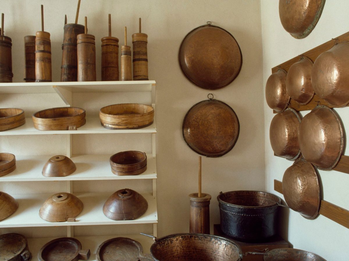 Copper and wooden pots and kitchen utensils