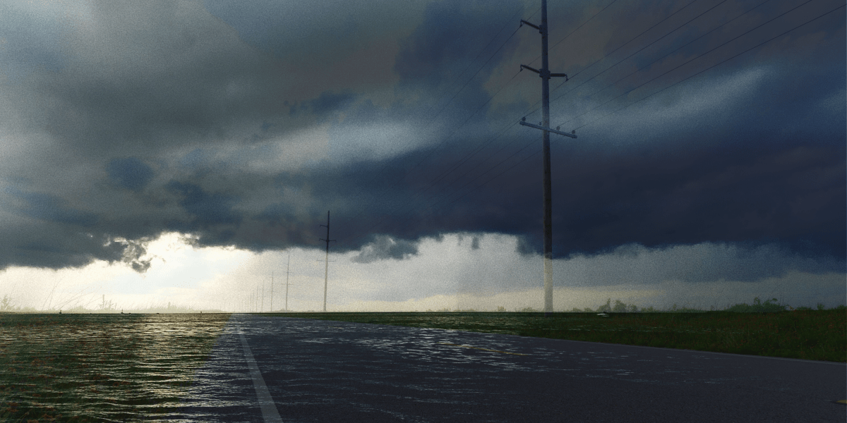 A foreboding, dark sky over a flooded highway