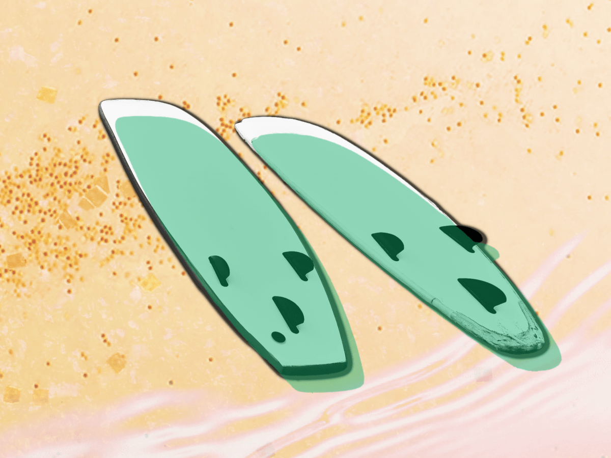 An illustration of two green surfboards, face down in the sand at the edge of the water.